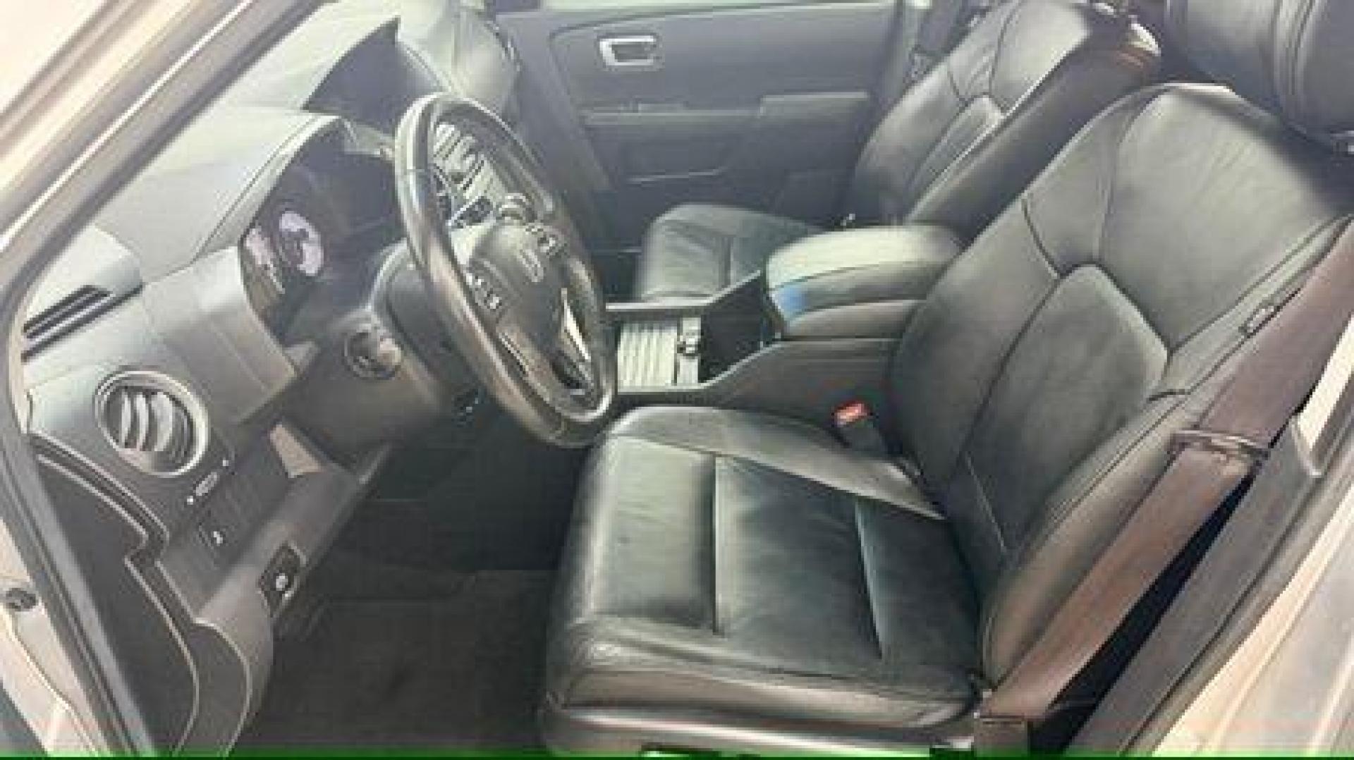 2012 Silver Honda Pilot EX-L (5FNYF3H65CB) with an 3.5L V-6 i-VTEC VCM variable valve control engine, located at 1806 Veterans Memorial Hwy SW, Austell, GA, 30168, (770) 944-9558, 33.817959, -84.606987 - Photo#12