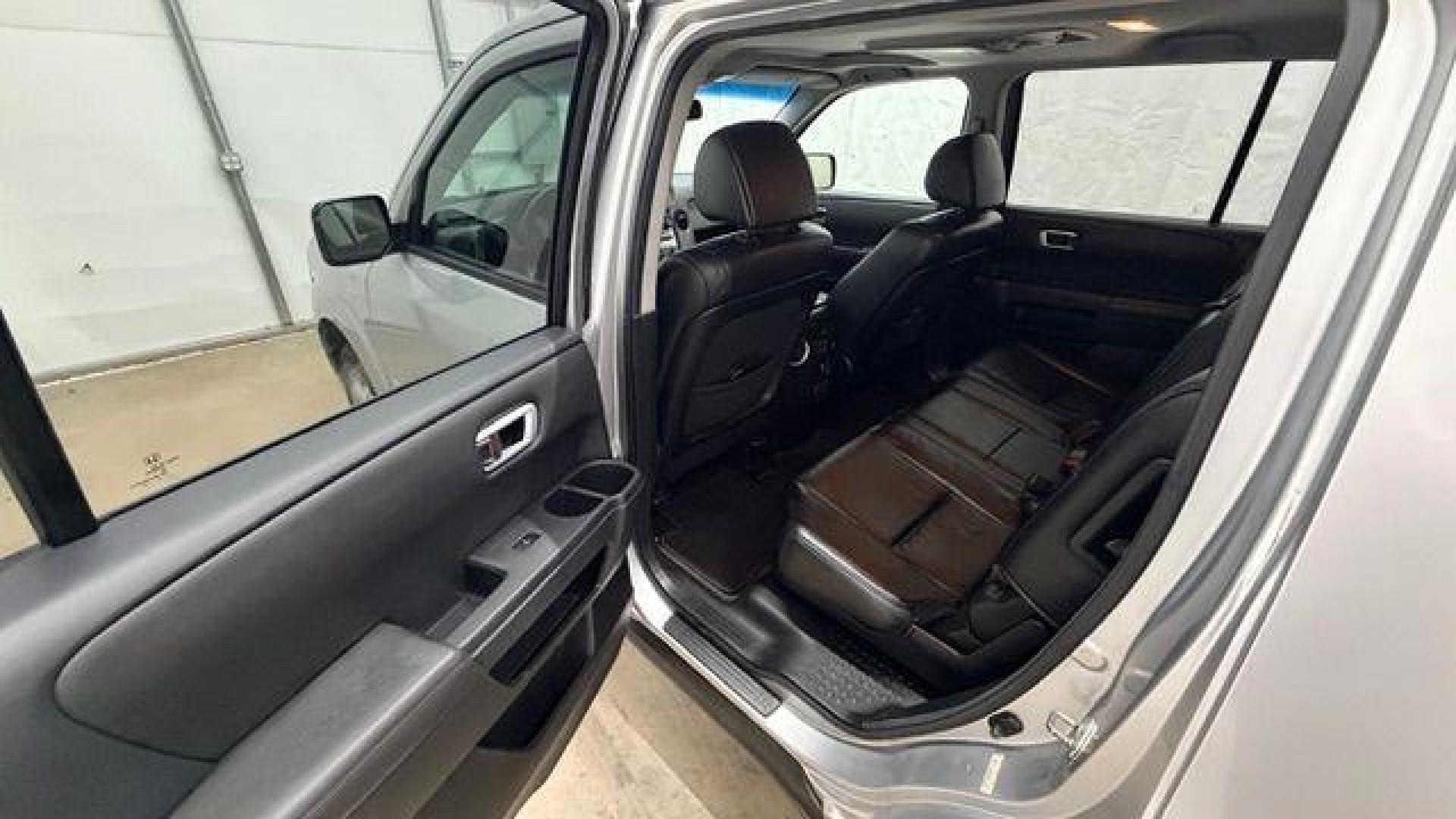 2012 Silver Honda Pilot EX-L (5FNYF3H65CB) with an 3.5L V-6 i-VTEC VCM variable valve control engine, located at 1806 Veterans Memorial Hwy SW, Austell, GA, 30168, (770) 944-9558, 33.817959, -84.606987 - Photo#14