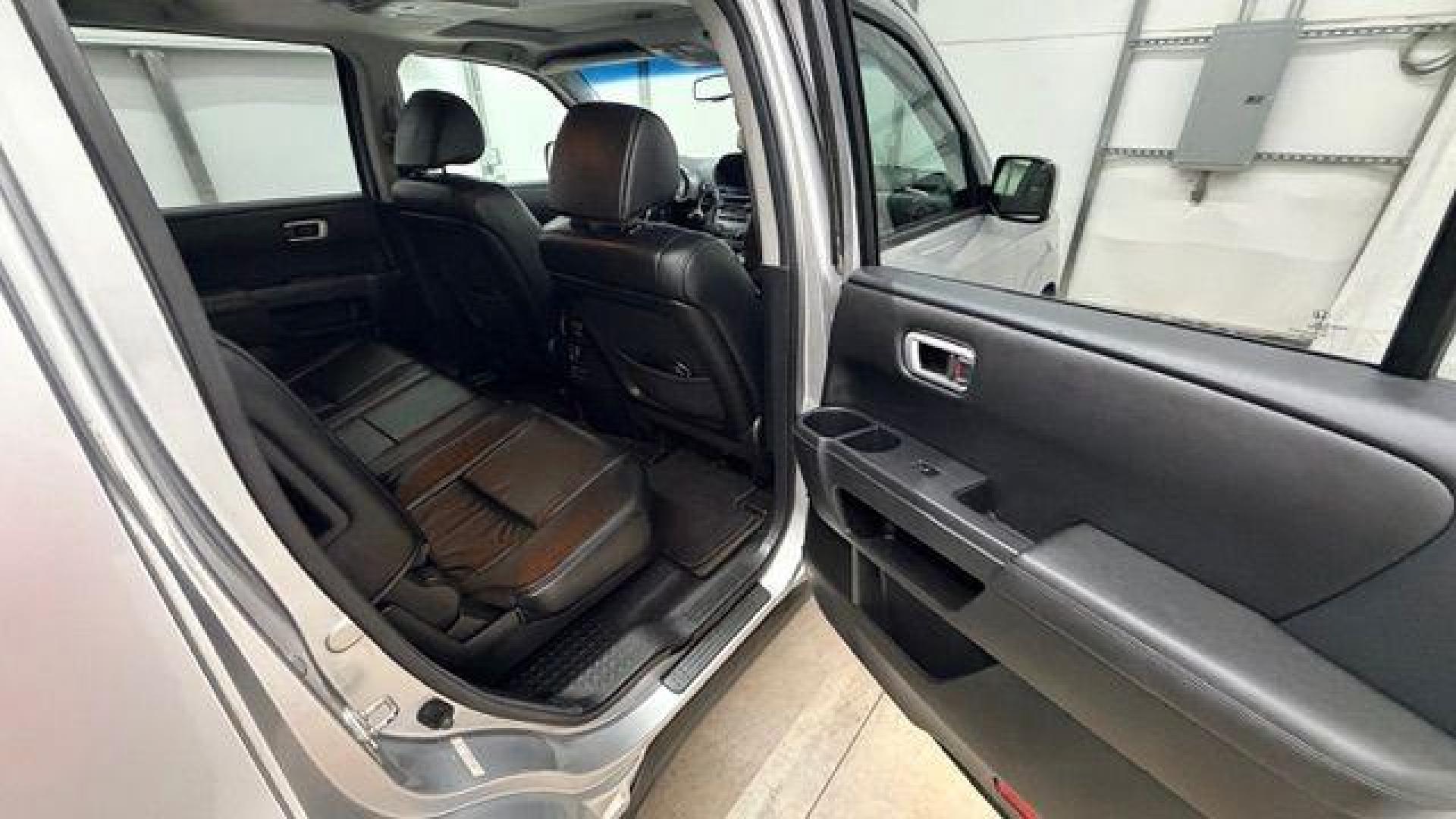 2012 Silver Honda Pilot EX-L (5FNYF3H65CB) with an 3.5L V-6 i-VTEC VCM variable valve control engine, located at 1806 Veterans Memorial Hwy SW, Austell, GA, 30168, (770) 944-9558, 33.817959, -84.606987 - Photo#16