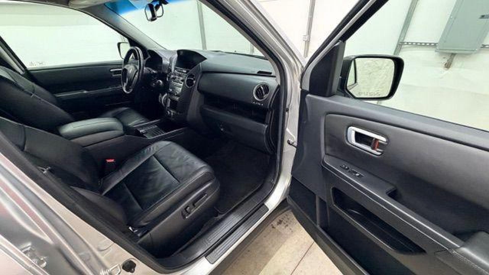 2012 Silver Honda Pilot EX-L (5FNYF3H65CB) with an 3.5L V-6 i-VTEC VCM variable valve control engine, located at 1806 Veterans Memorial Hwy SW, Austell, GA, 30168, (770) 944-9558, 33.817959, -84.606987 - Photo#18