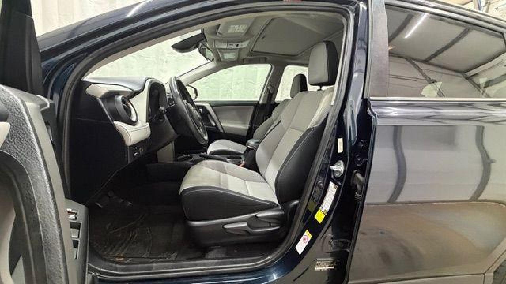 2017 Blue Toyota RAV4 XLE (2T3WFREV0HW) with an 2.5L I-4 DOHC engine, located at 1806 Veterans Memorial Hwy SW, Austell, GA, 30168, (770) 944-9558, 33.817959, -84.606987 - Photo#13