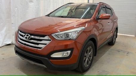 2014 Orange Hyundai Santa Fe Sport 2.4L (5XYZU3LB0EG) with an Theta II 2.4L I-4 gasoline direct injection engine, located at 1806 Veterans Memorial Hwy SW, Austell, GA, 30168, (770) 944-9558, 33.817959, -84.606987 - Photo#0