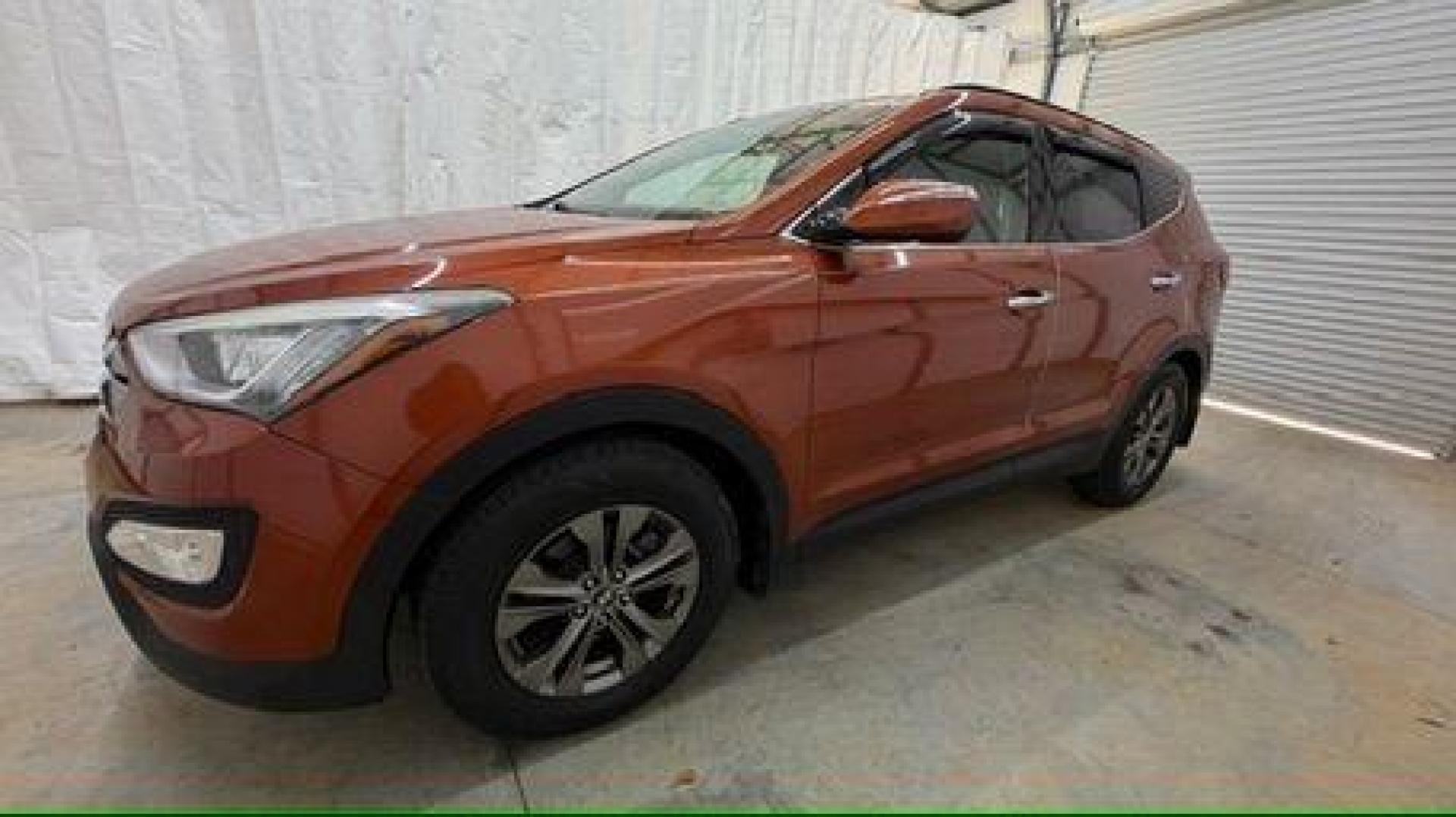 2014 Orange Hyundai Santa Fe Sport 2.4L (5XYZU3LB0EG) with an Theta II 2.4L I-4 gasoline direct injection engine, located at 1806 Veterans Memorial Hwy SW, Austell, GA, 30168, (770) 944-9558, 33.817959, -84.606987 - Photo#1