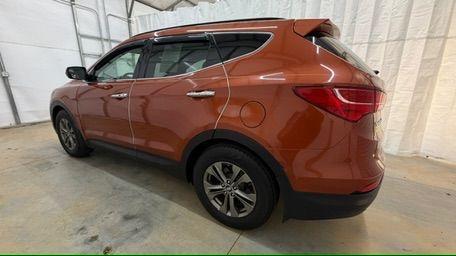 2014 Orange Hyundai Santa Fe Sport 2.4L (5XYZU3LB0EG) with an Theta II 2.4L I-4 gasoline direct injection engine, located at 1806 Veterans Memorial Hwy SW, Austell, GA, 30168, (770) 944-9558, 33.817959, -84.606987 - Photo#2