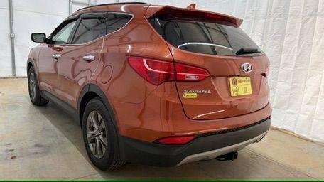 2014 Orange Hyundai Santa Fe Sport 2.4L (5XYZU3LB0EG) with an Theta II 2.4L I-4 gasoline direct injection engine, located at 1806 Veterans Memorial Hwy SW, Austell, GA, 30168, (770) 944-9558, 33.817959, -84.606987 - Photo#3
