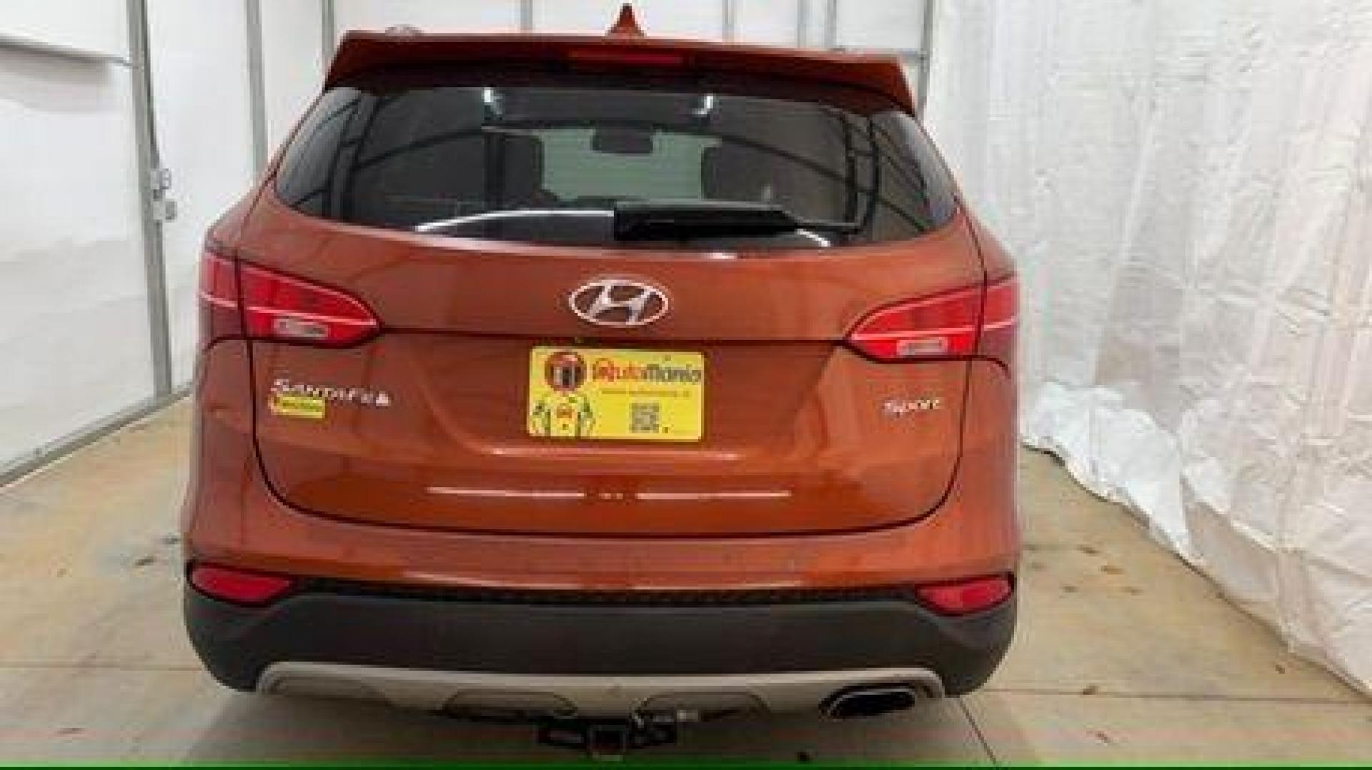 2014 Orange Hyundai Santa Fe Sport 2.4L (5XYZU3LB0EG) with an Theta II 2.4L I-4 gasoline direct injection engine, located at 1806 Veterans Memorial Hwy SW, Austell, GA, 30168, (770) 944-9558, 33.817959, -84.606987 - Photo#4
