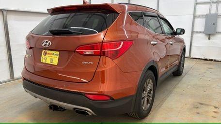 2014 Orange Hyundai Santa Fe Sport 2.4L (5XYZU3LB0EG) with an Theta II 2.4L I-4 gasoline direct injection engine, located at 1806 Veterans Memorial Hwy SW, Austell, GA, 30168, (770) 944-9558, 33.817959, -84.606987 - Photo#6