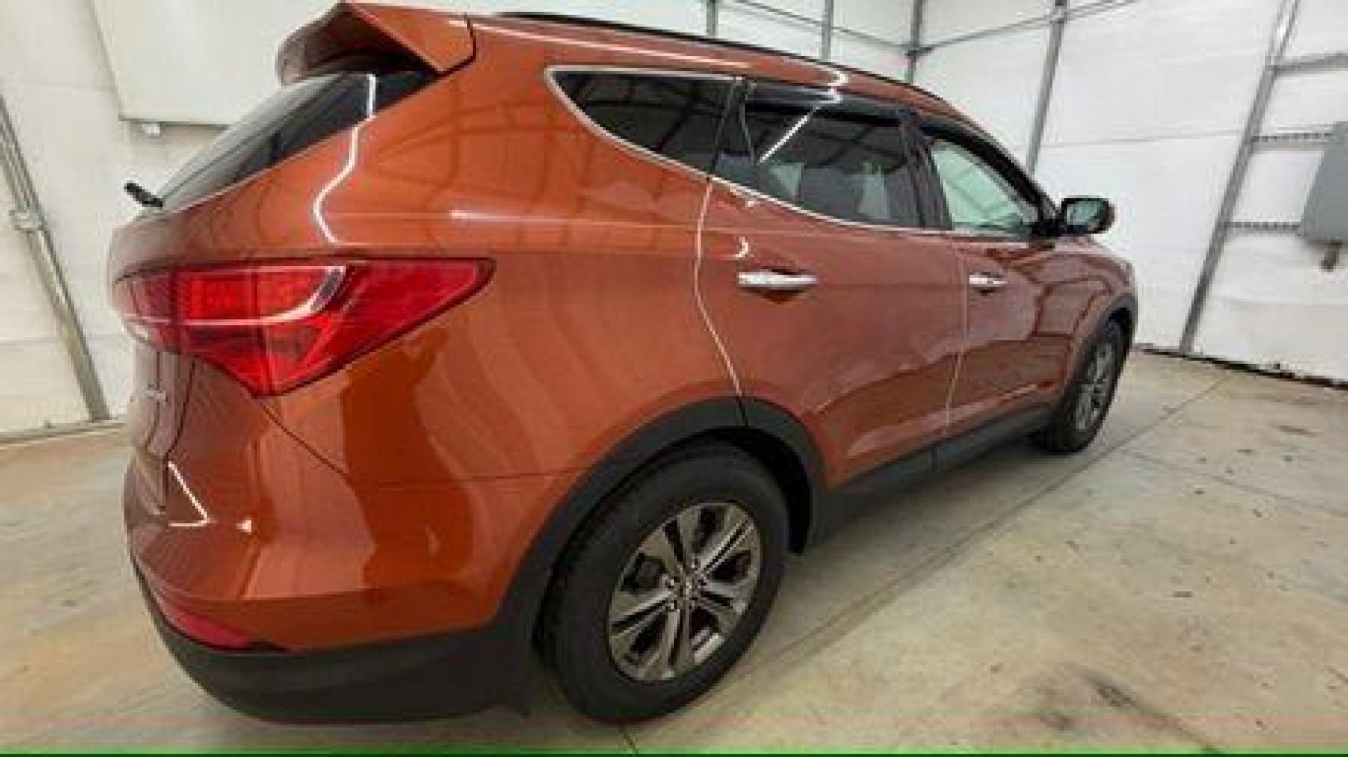 2014 Orange Hyundai Santa Fe Sport 2.4L (5XYZU3LB0EG) with an Theta II 2.4L I-4 gasoline direct injection engine, located at 1806 Veterans Memorial Hwy SW, Austell, GA, 30168, (770) 944-9558, 33.817959, -84.606987 - Photo#7