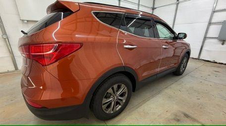 2014 Orange Hyundai Santa Fe Sport 2.4L (5XYZU3LB0EG) with an Theta II 2.4L I-4 gasoline direct injection engine, located at 1806 Veterans Memorial Hwy SW, Austell, GA, 30168, (770) 944-9558, 33.817959, -84.606987 - Photo#7