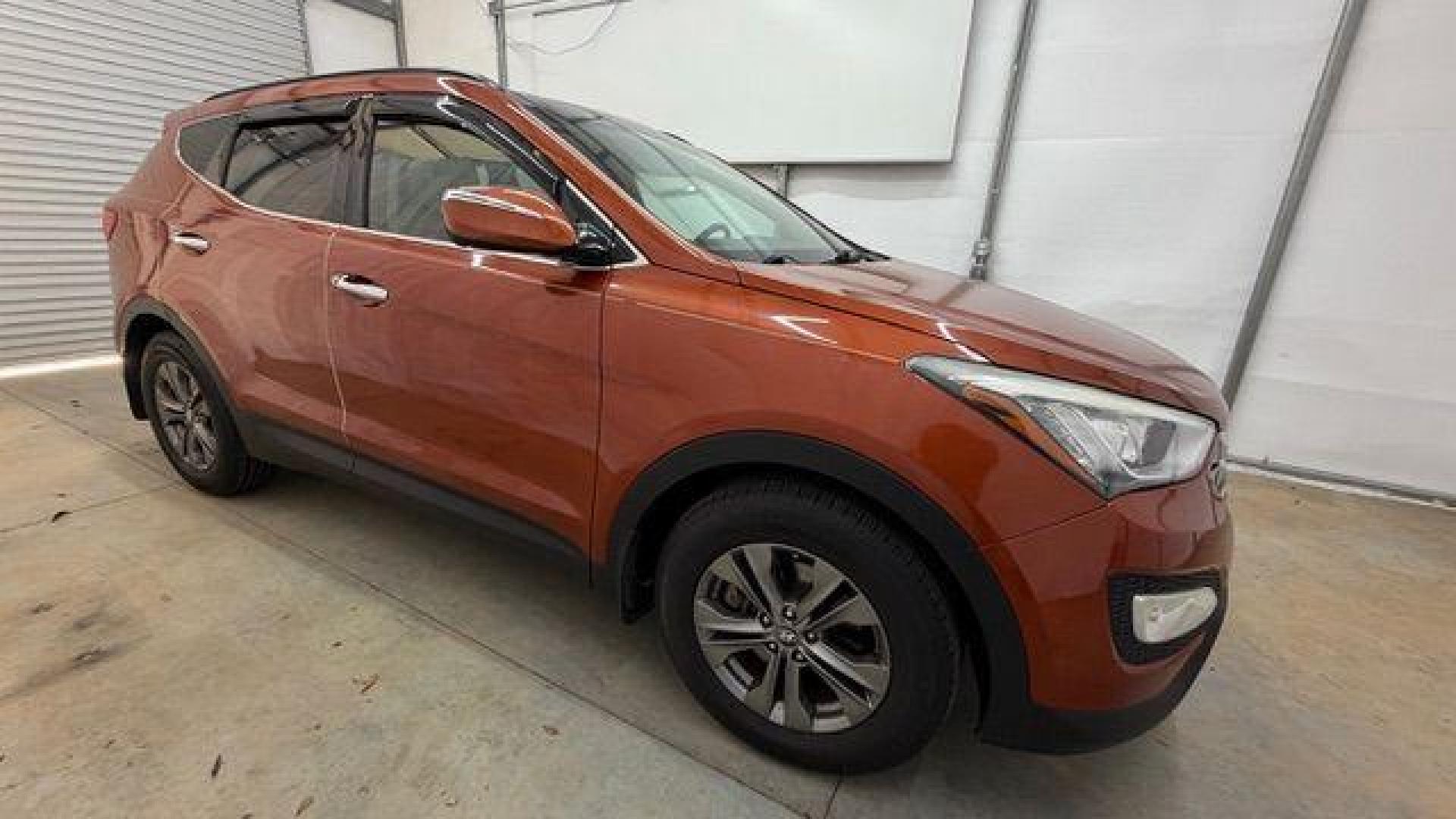 2014 Orange Hyundai Santa Fe Sport 2.4L (5XYZU3LB0EG) with an Theta II 2.4L I-4 gasoline direct injection engine, located at 1806 Veterans Memorial Hwy SW, Austell, GA, 30168, (770) 944-9558, 33.817959, -84.606987 - Photo#8