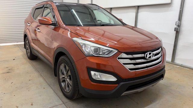 2014 Orange Hyundai Santa Fe Sport 2.4L (5XYZU3LB0EG) with an Theta II 2.4L I-4 gasoline direct injection engine, located at 1806 Veterans Memorial Hwy SW, Austell, GA, 30168, (770) 944-9558, 33.817959, -84.606987 - Photo#9