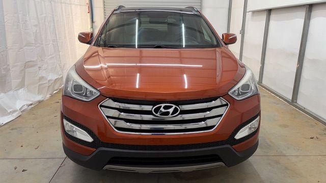 2014 Orange Hyundai Santa Fe Sport 2.4L (5XYZU3LB0EG) with an Theta II 2.4L I-4 gasoline direct injection engine, located at 1806 Veterans Memorial Hwy SW, Austell, GA, 30168, (770) 944-9558, 33.817959, -84.606987 - Photo#10