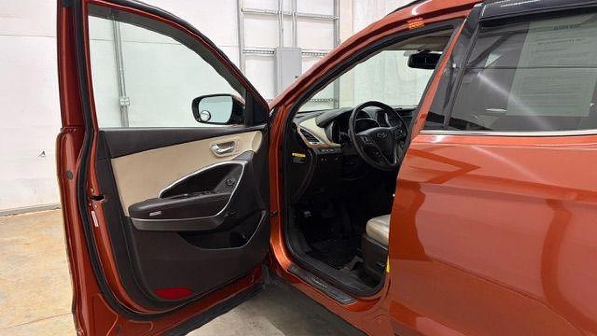 2014 Orange Hyundai Santa Fe Sport 2.4L (5XYZU3LB0EG) with an Theta II 2.4L I-4 gasoline direct injection engine, located at 1806 Veterans Memorial Hwy SW, Austell, GA, 30168, (770) 944-9558, 33.817959, -84.606987 - Photo#11