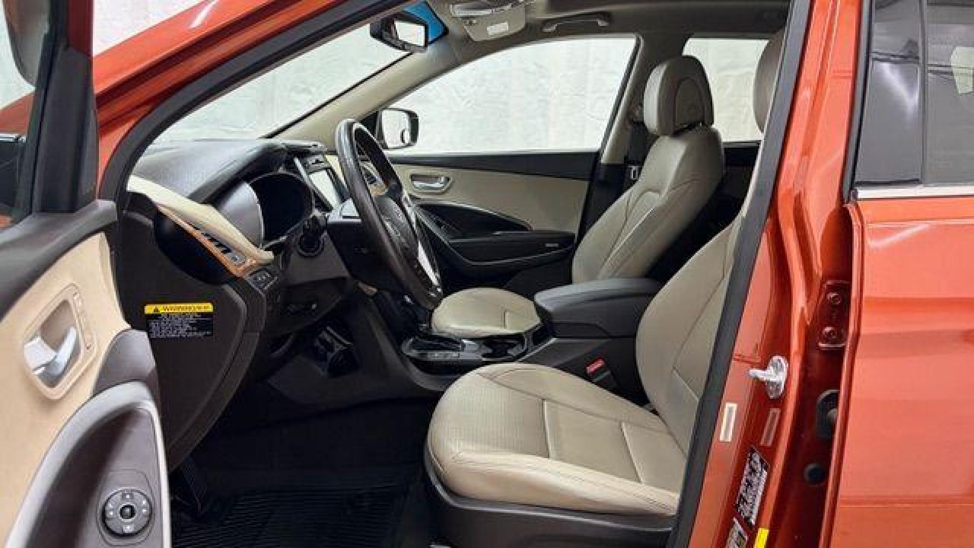 2014 Orange Hyundai Santa Fe Sport 2.4L (5XYZU3LB0EG) with an Theta II 2.4L I-4 gasoline direct injection engine, located at 1806 Veterans Memorial Hwy SW, Austell, GA, 30168, (770) 944-9558, 33.817959, -84.606987 - Photo#12