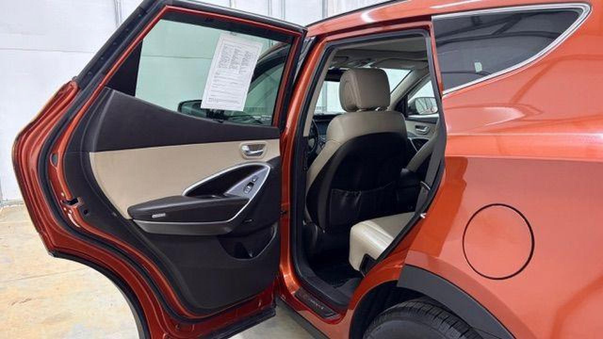 2014 Orange Hyundai Santa Fe Sport 2.4L (5XYZU3LB0EG) with an Theta II 2.4L I-4 gasoline direct injection engine, located at 1806 Veterans Memorial Hwy SW, Austell, GA, 30168, (770) 944-9558, 33.817959, -84.606987 - Photo#14