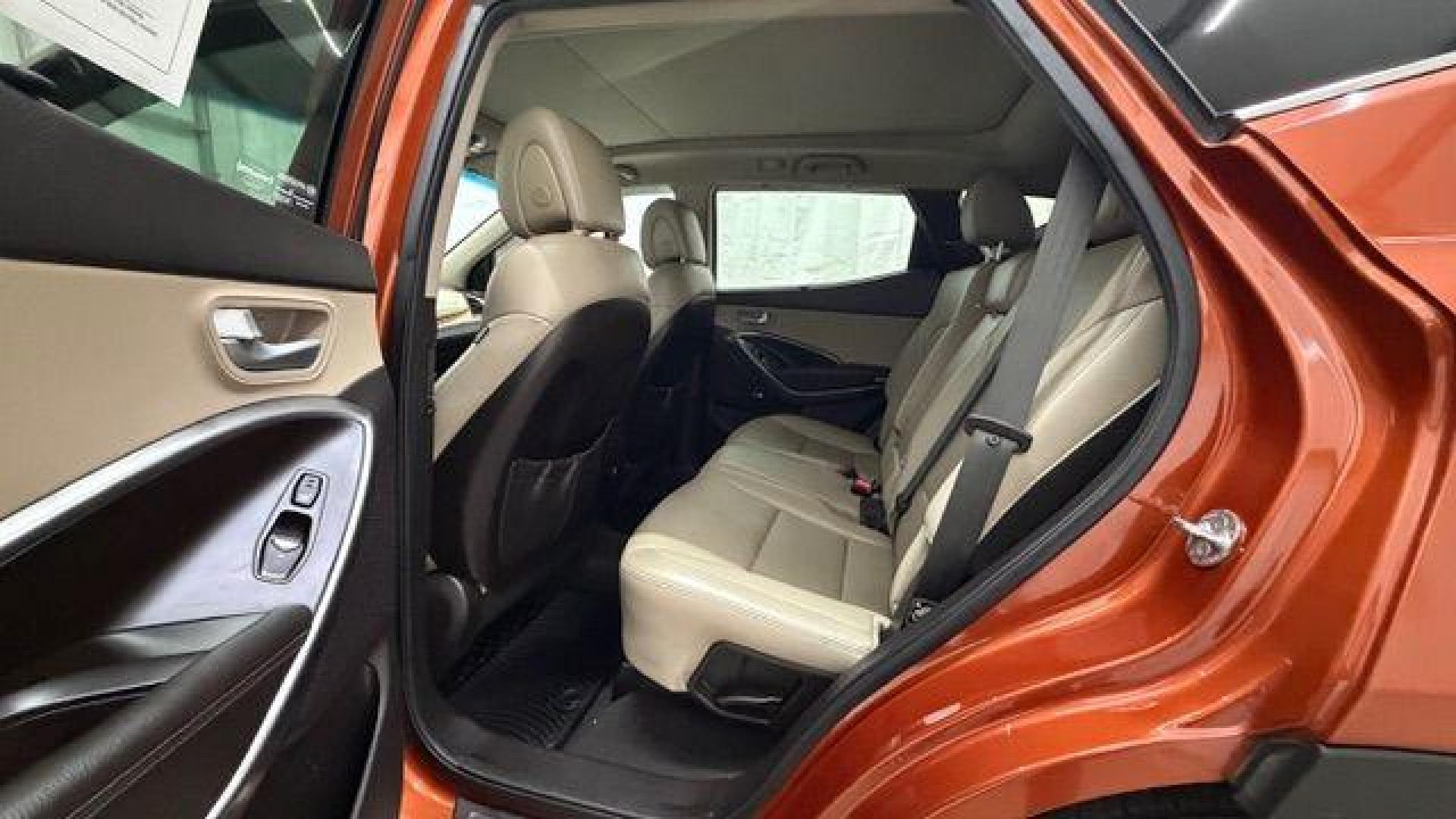 2014 Orange Hyundai Santa Fe Sport 2.4L (5XYZU3LB0EG) with an Theta II 2.4L I-4 gasoline direct injection engine, located at 1806 Veterans Memorial Hwy SW, Austell, GA, 30168, (770) 944-9558, 33.817959, -84.606987 - Photo#15