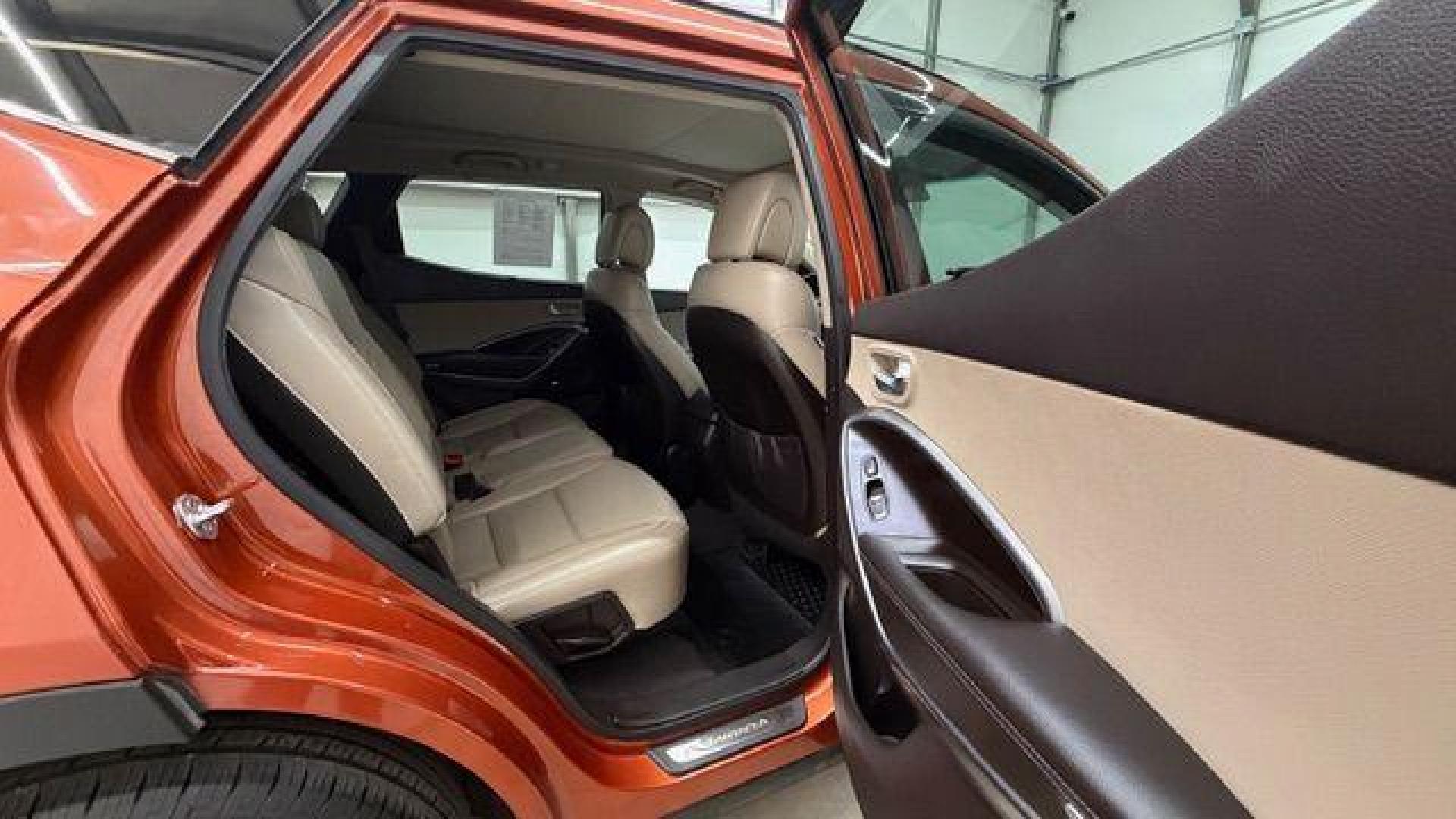 2014 Orange Hyundai Santa Fe Sport 2.4L (5XYZU3LB0EG) with an Theta II 2.4L I-4 gasoline direct injection engine, located at 1806 Veterans Memorial Hwy SW, Austell, GA, 30168, (770) 944-9558, 33.817959, -84.606987 - Photo#17