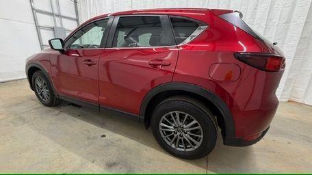 2017 Red Mazda CX-5 Touring (JM3KFBCL5H0) with an SKYACTIV-G 2.5L I-4 gasoline direct injection engine, located at 1806 Veterans Memorial Hwy SW, Austell, GA, 30168, (770) 944-9558, 33.817959, -84.606987 - Photo#2