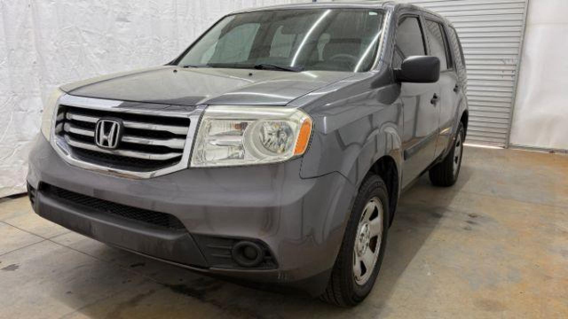 2015 Gray Honda Pilot LX (5FNYF3H28FB) with an 3.5L V-6 i-VTEC VCM variable valve control engine, located at 1806 Veterans Memorial Hwy SW, Austell, GA, 30168, (770) 944-9558, 33.817959, -84.606987- Photo#0