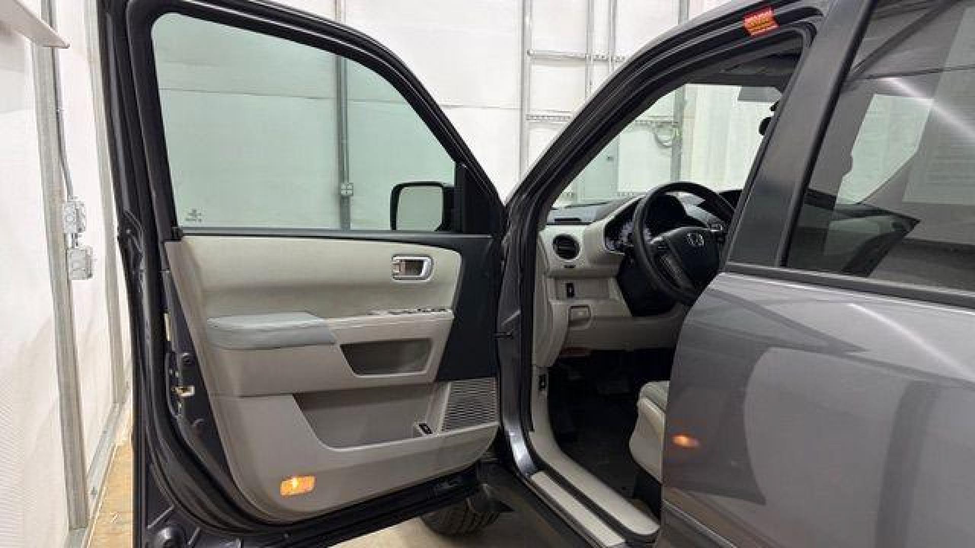 2015 Gray Honda Pilot LX (5FNYF3H28FB) with an 3.5L V-6 i-VTEC VCM variable valve control engine, located at 1806 Veterans Memorial Hwy SW, Austell, GA, 30168, (770) 944-9558, 33.817959, -84.606987- Photo#10