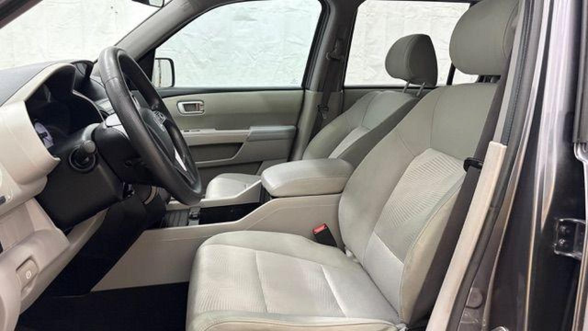 2015 Gray Honda Pilot LX (5FNYF3H28FB) with an 3.5L V-6 i-VTEC VCM variable valve control engine, located at 1806 Veterans Memorial Hwy SW, Austell, GA, 30168, (770) 944-9558, 33.817959, -84.606987- Photo#11