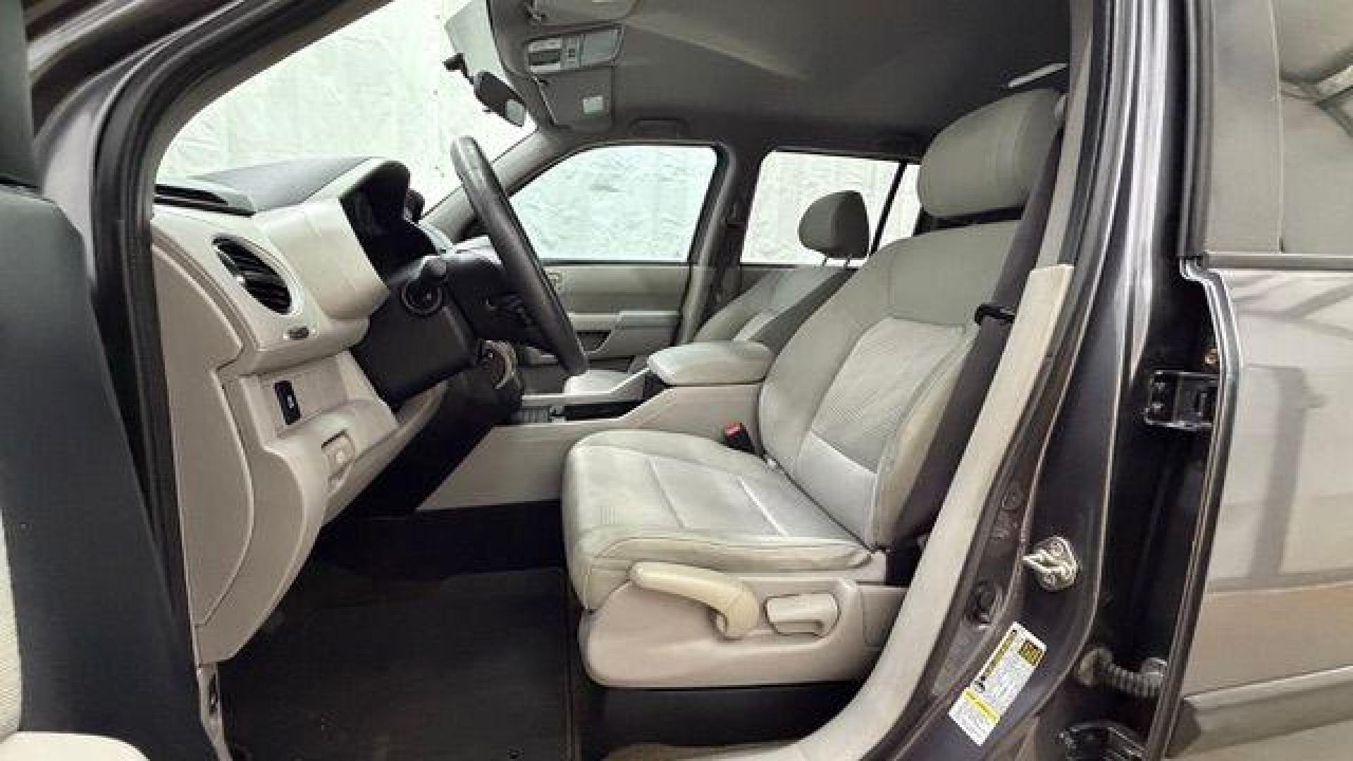 2015 Gray Honda Pilot LX (5FNYF3H28FB) with an 3.5L V-6 i-VTEC VCM variable valve control engine, located at 1806 Veterans Memorial Hwy SW, Austell, GA, 30168, (770) 944-9558, 33.817959, -84.606987- Photo#12