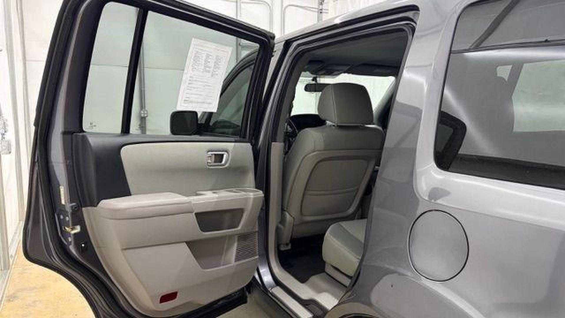2015 Gray Honda Pilot LX (5FNYF3H28FB) with an 3.5L V-6 i-VTEC VCM variable valve control engine, located at 1806 Veterans Memorial Hwy SW, Austell, GA, 30168, (770) 944-9558, 33.817959, -84.606987- Photo#13