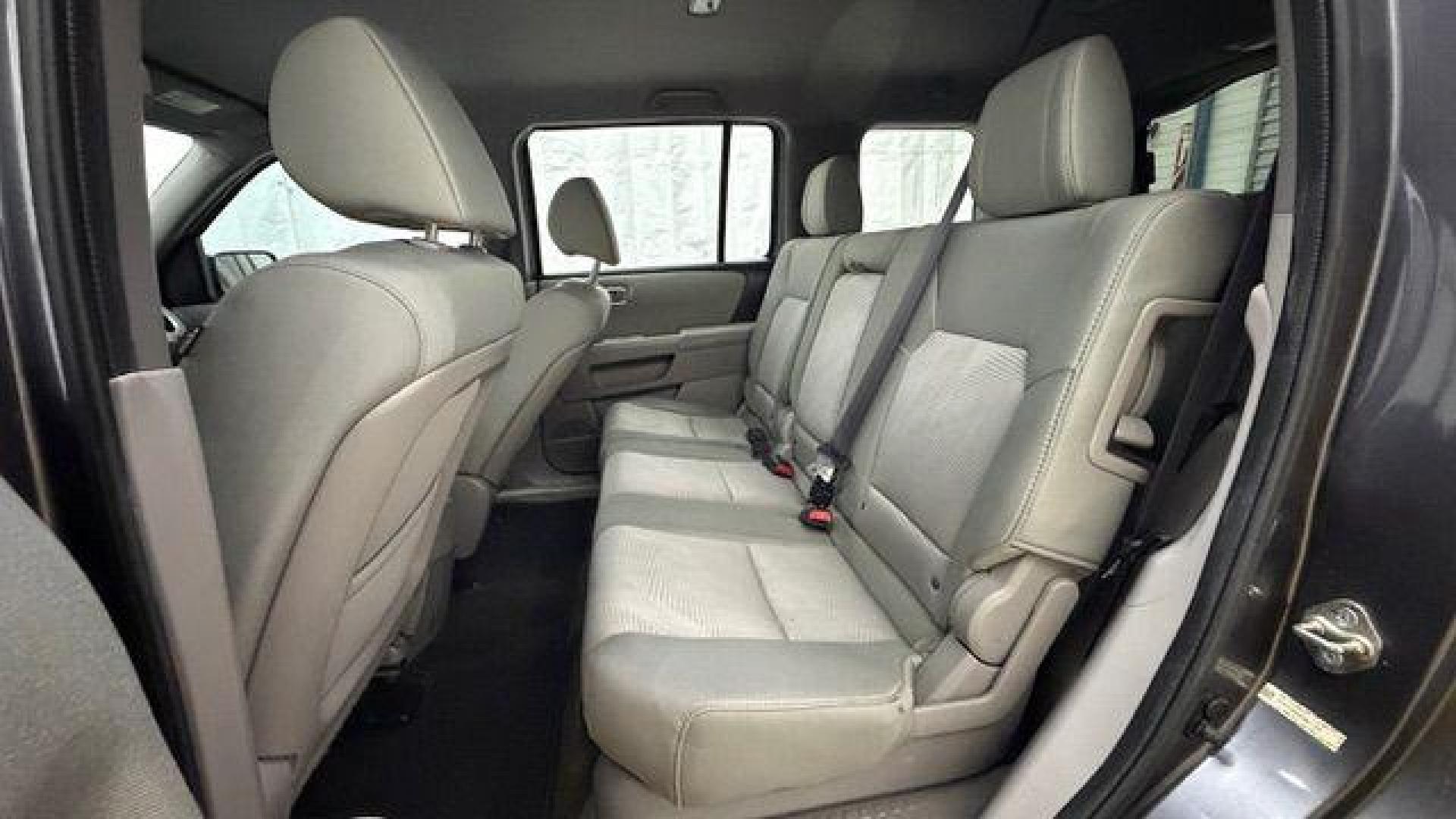 2015 Gray Honda Pilot LX (5FNYF3H28FB) with an 3.5L V-6 i-VTEC VCM variable valve control engine, located at 1806 Veterans Memorial Hwy SW, Austell, GA, 30168, (770) 944-9558, 33.817959, -84.606987- Photo#14