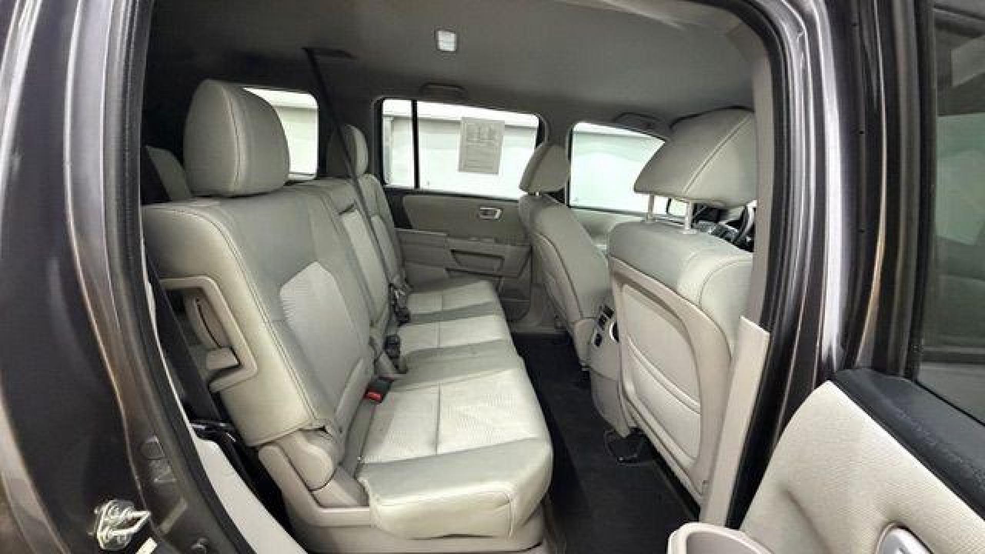 2015 Gray Honda Pilot LX (5FNYF3H28FB) with an 3.5L V-6 i-VTEC VCM variable valve control engine, located at 1806 Veterans Memorial Hwy SW, Austell, GA, 30168, (770) 944-9558, 33.817959, -84.606987- Photo#18