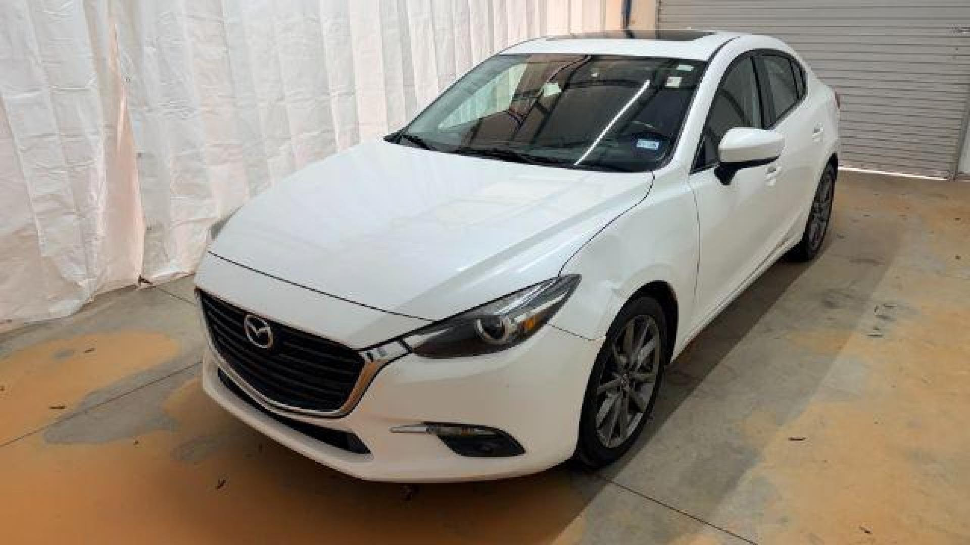 2018 White Mazda Mazda3 Grand Touring (3MZBN1W38JM) with an SKYACTIV-G 2.5L I-4 gasoline direct injection engine, located at 1806 Veterans Memorial Hwy SW, Austell, GA, 30168, (770) 944-9558, 33.817959, -84.606987 - Photo#0