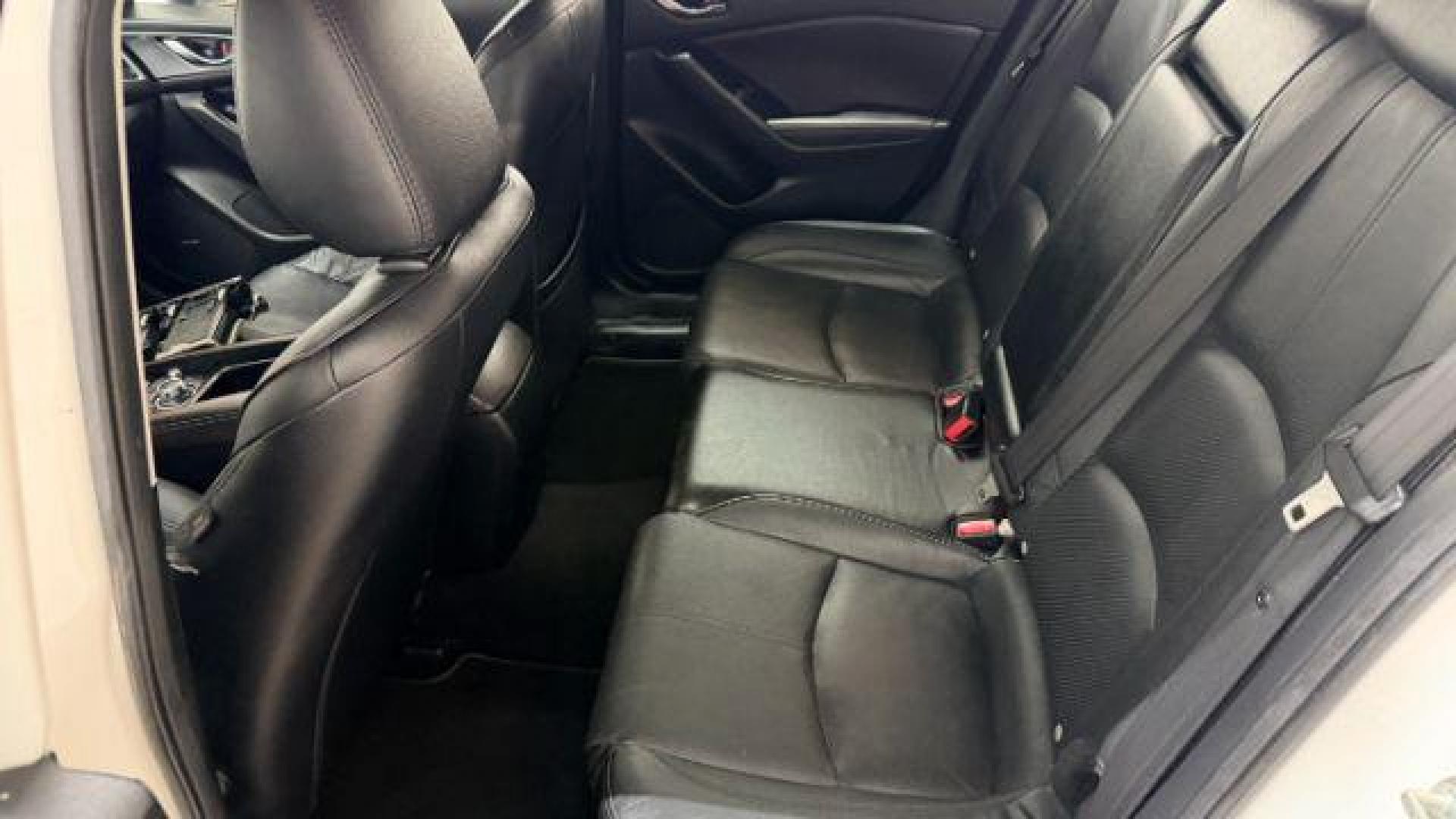 2018 White Mazda Mazda3 Grand Touring (3MZBN1W38JM) with an SKYACTIV-G 2.5L I-4 gasoline direct injection engine, located at 1806 Veterans Memorial Hwy SW, Austell, GA, 30168, (770) 944-9558, 33.817959, -84.606987 - Photo#13