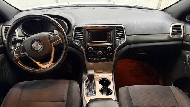 2016 White Jeep Grand Cherokee Laredo (1C4RJEAG6GC) with an Pentastar 3.6L V-6 DOHC engine, located at 1806 Veterans Memorial Hwy SW, Austell, GA, 30168, (770) 944-9558, 33.817959, -84.606987 - Photo#14