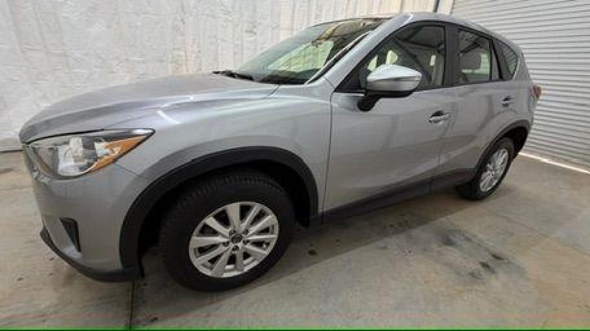 2015 Silver Mazda CX-5 Sport (JM3KE2BE8F0) with an SKYACTIV-G 2L I-4 gasoline direct injection engine, located at 1806 Veterans Memorial Hwy SW, Austell, GA, 30168, (770) 944-9558, 33.817959, -84.606987 - Photo#1