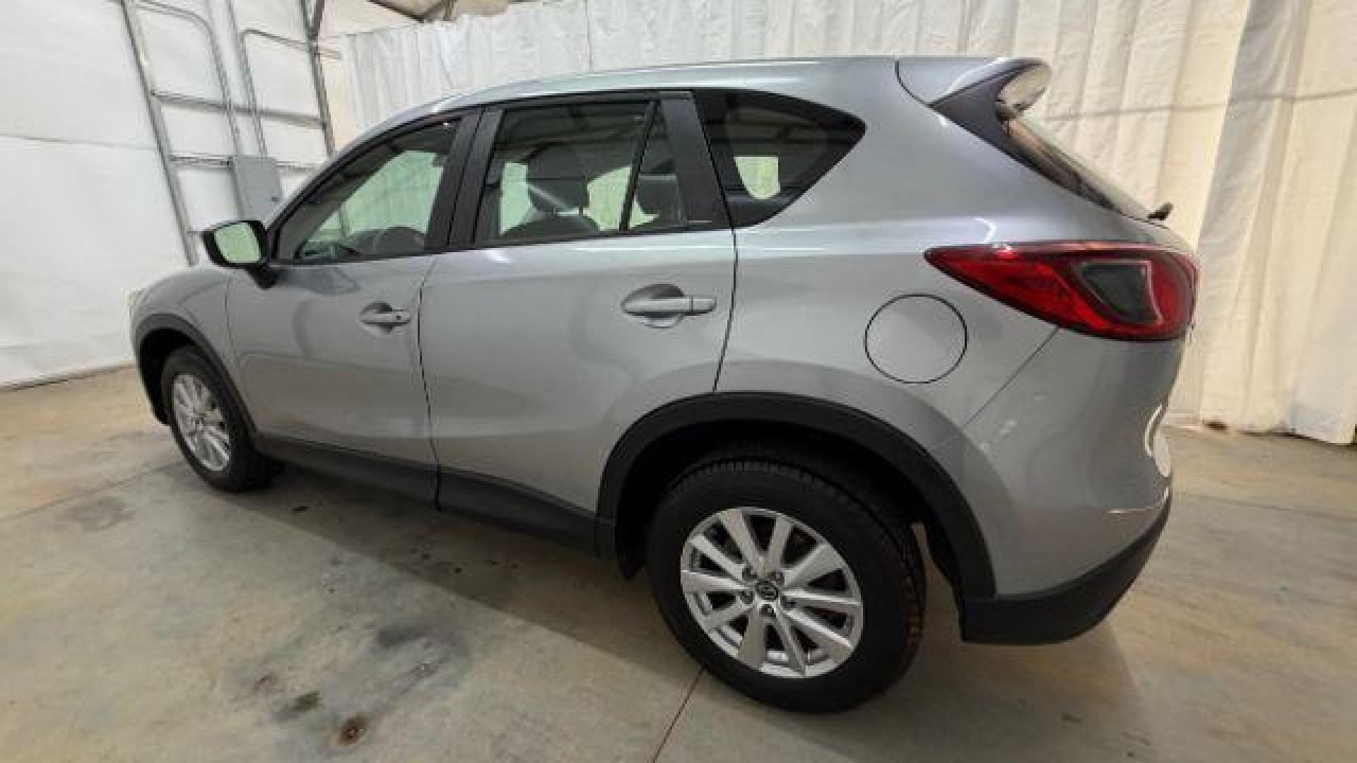 2015 Silver Mazda CX-5 Sport (JM3KE2BE8F0) with an SKYACTIV-G 2L I-4 gasoline direct injection engine, located at 1806 Veterans Memorial Hwy SW, Austell, GA, 30168, (770) 944-9558, 33.817959, -84.606987 - Photo#2