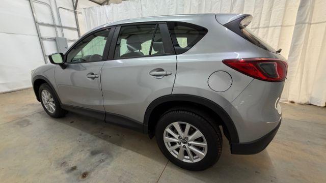 2015 Silver Mazda CX-5 Sport (JM3KE2BE8F0) with an SKYACTIV-G 2L I-4 gasoline direct injection engine, located at 1806 Veterans Memorial Hwy SW, Austell, GA, 30168, (770) 944-9558, 33.817959, -84.606987 - Photo#2