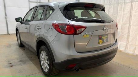 2015 Silver Mazda CX-5 Sport (JM3KE2BE8F0) with an SKYACTIV-G 2L I-4 gasoline direct injection engine, located at 1806 Veterans Memorial Hwy SW, Austell, GA, 30168, (770) 944-9558, 33.817959, -84.606987 - Photo#3