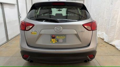 2015 Silver Mazda CX-5 Sport (JM3KE2BE8F0) with an SKYACTIV-G 2L I-4 gasoline direct injection engine, located at 1806 Veterans Memorial Hwy SW, Austell, GA, 30168, (770) 944-9558, 33.817959, -84.606987 - Photo#4