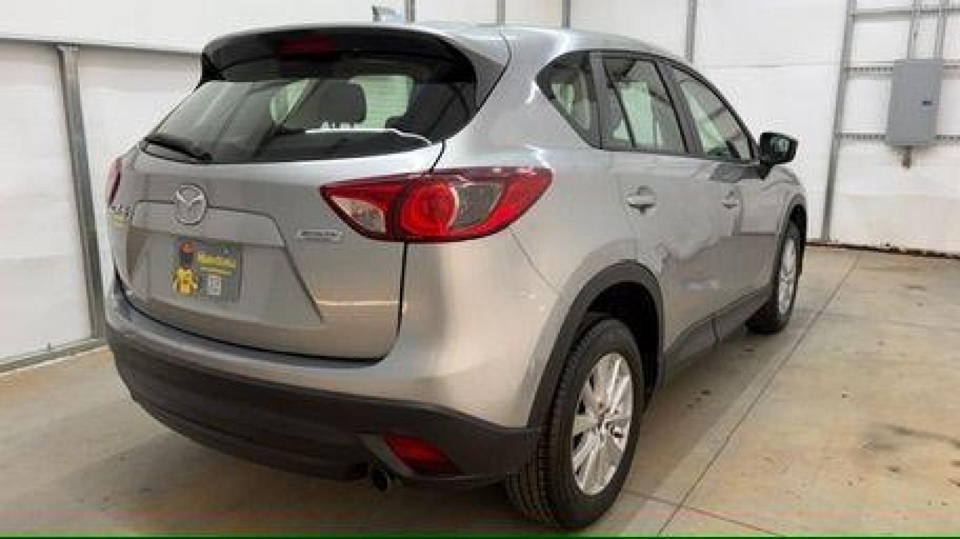 2015 Silver Mazda CX-5 Sport (JM3KE2BE8F0) with an SKYACTIV-G 2L I-4 gasoline direct injection engine, located at 1806 Veterans Memorial Hwy SW, Austell, GA, 30168, (770) 944-9558, 33.817959, -84.606987 - Photo#5