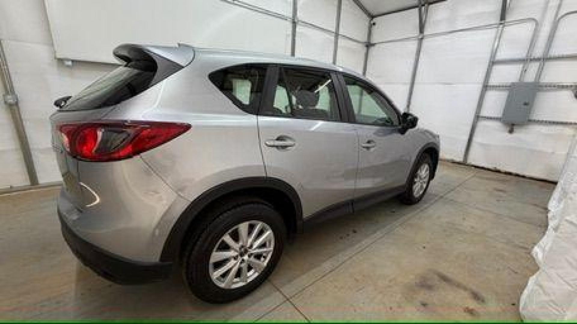 2015 Silver Mazda CX-5 Sport (JM3KE2BE8F0) with an SKYACTIV-G 2L I-4 gasoline direct injection engine, located at 1806 Veterans Memorial Hwy SW, Austell, GA, 30168, (770) 944-9558, 33.817959, -84.606987 - Photo#6