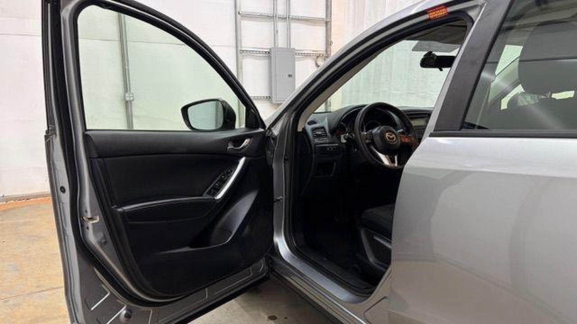 2015 Silver Mazda CX-5 Sport (JM3KE2BE8F0) with an SKYACTIV-G 2L I-4 gasoline direct injection engine, located at 1806 Veterans Memorial Hwy SW, Austell, GA, 30168, (770) 944-9558, 33.817959, -84.606987 - Photo#10