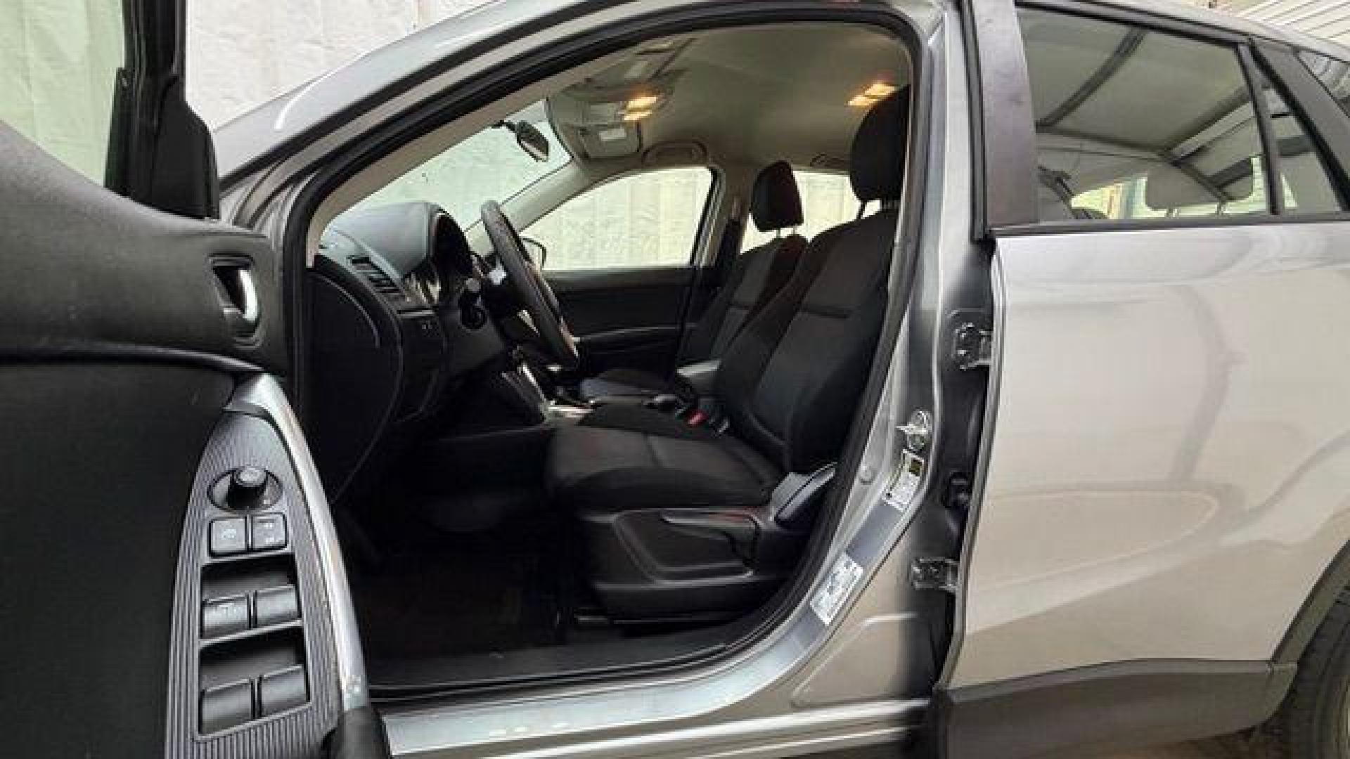 2015 Silver Mazda CX-5 Sport (JM3KE2BE8F0) with an SKYACTIV-G 2L I-4 gasoline direct injection engine, located at 1806 Veterans Memorial Hwy SW, Austell, GA, 30168, (770) 944-9558, 33.817959, -84.606987 - Photo#12