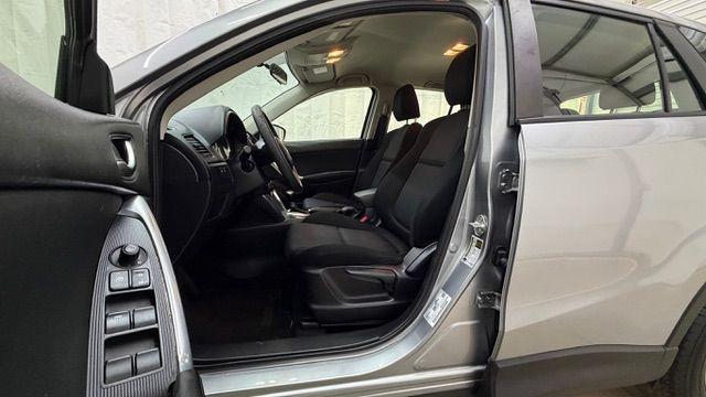 2015 Silver Mazda CX-5 Sport (JM3KE2BE8F0) with an SKYACTIV-G 2L I-4 gasoline direct injection engine, located at 1806 Veterans Memorial Hwy SW, Austell, GA, 30168, (770) 944-9558, 33.817959, -84.606987 - Photo#12