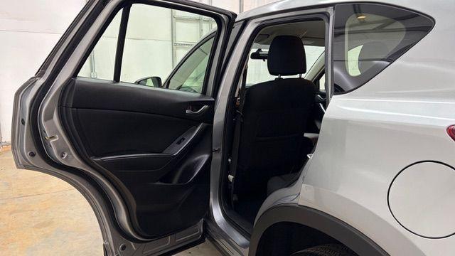 2015 Silver Mazda CX-5 Sport (JM3KE2BE8F0) with an SKYACTIV-G 2L I-4 gasoline direct injection engine, located at 1806 Veterans Memorial Hwy SW, Austell, GA, 30168, (770) 944-9558, 33.817959, -84.606987 - Photo#13
