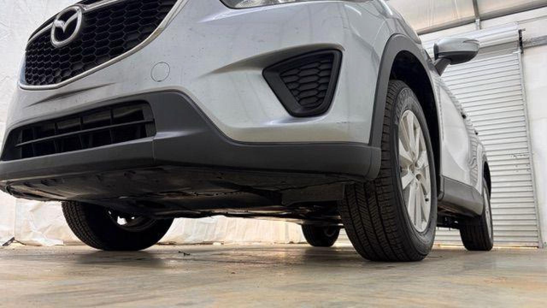 2015 Silver Mazda CX-5 Sport (JM3KE2BE8F0) with an SKYACTIV-G 2L I-4 gasoline direct injection engine, located at 1806 Veterans Memorial Hwy SW, Austell, GA, 30168, (770) 944-9558, 33.817959, -84.606987 - Photo#20