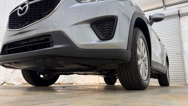 2015 Silver Mazda CX-5 Sport (JM3KE2BE8F0) with an SKYACTIV-G 2L I-4 gasoline direct injection engine, located at 1806 Veterans Memorial Hwy SW, Austell, GA, 30168, (770) 944-9558, 33.817959, -84.606987 - Photo#20