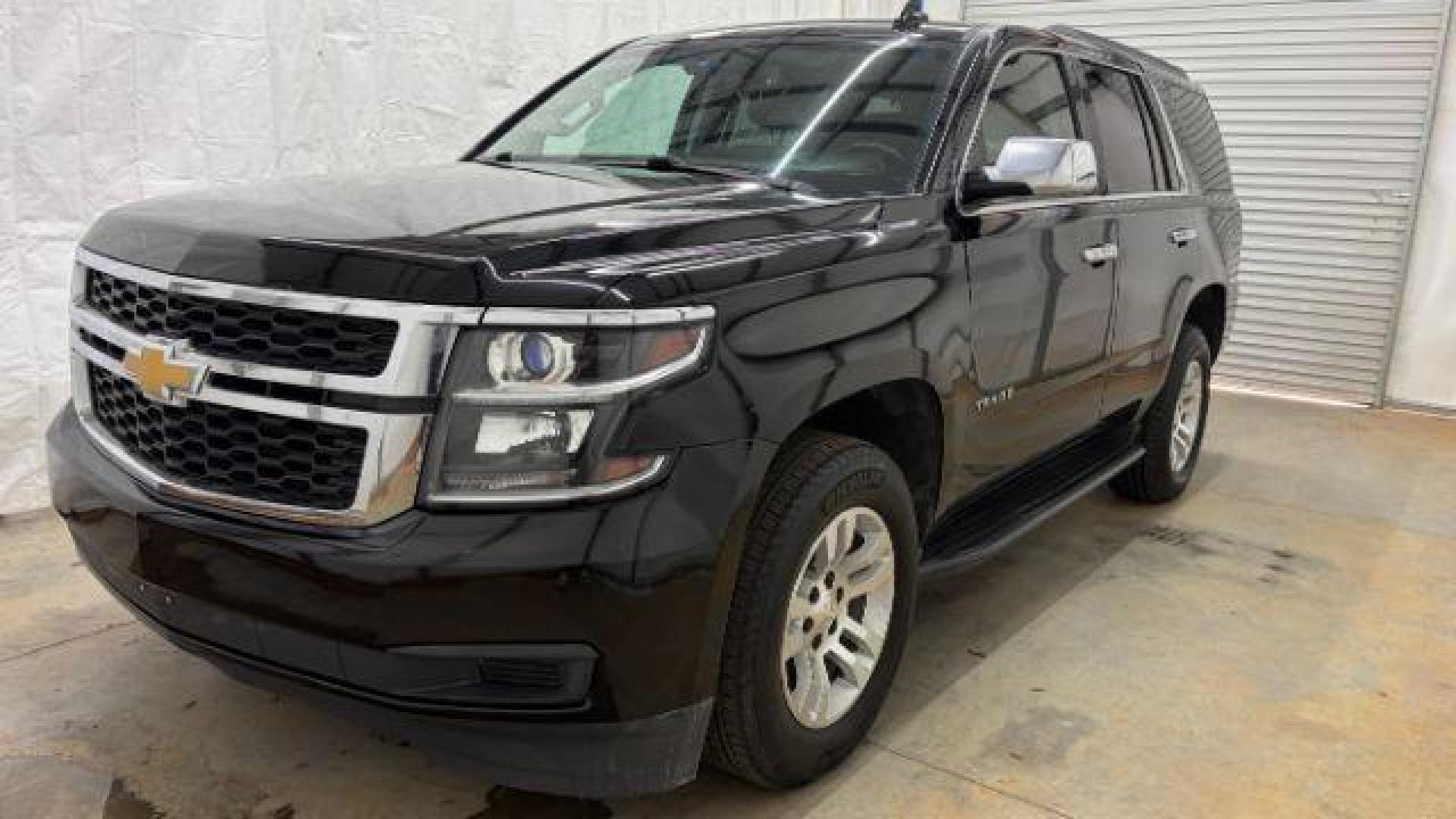 2017 BLACK Chevrolet Tahoe LT (1GNSKBKC1HR) with an EcoTec3 5.3L V-8 gasoline direct injection engine, located at 1806 Veterans Memorial Hwy SW, Austell, GA, 30168, (770) 944-9558, 33.817959, -84.606987 - Photo#0