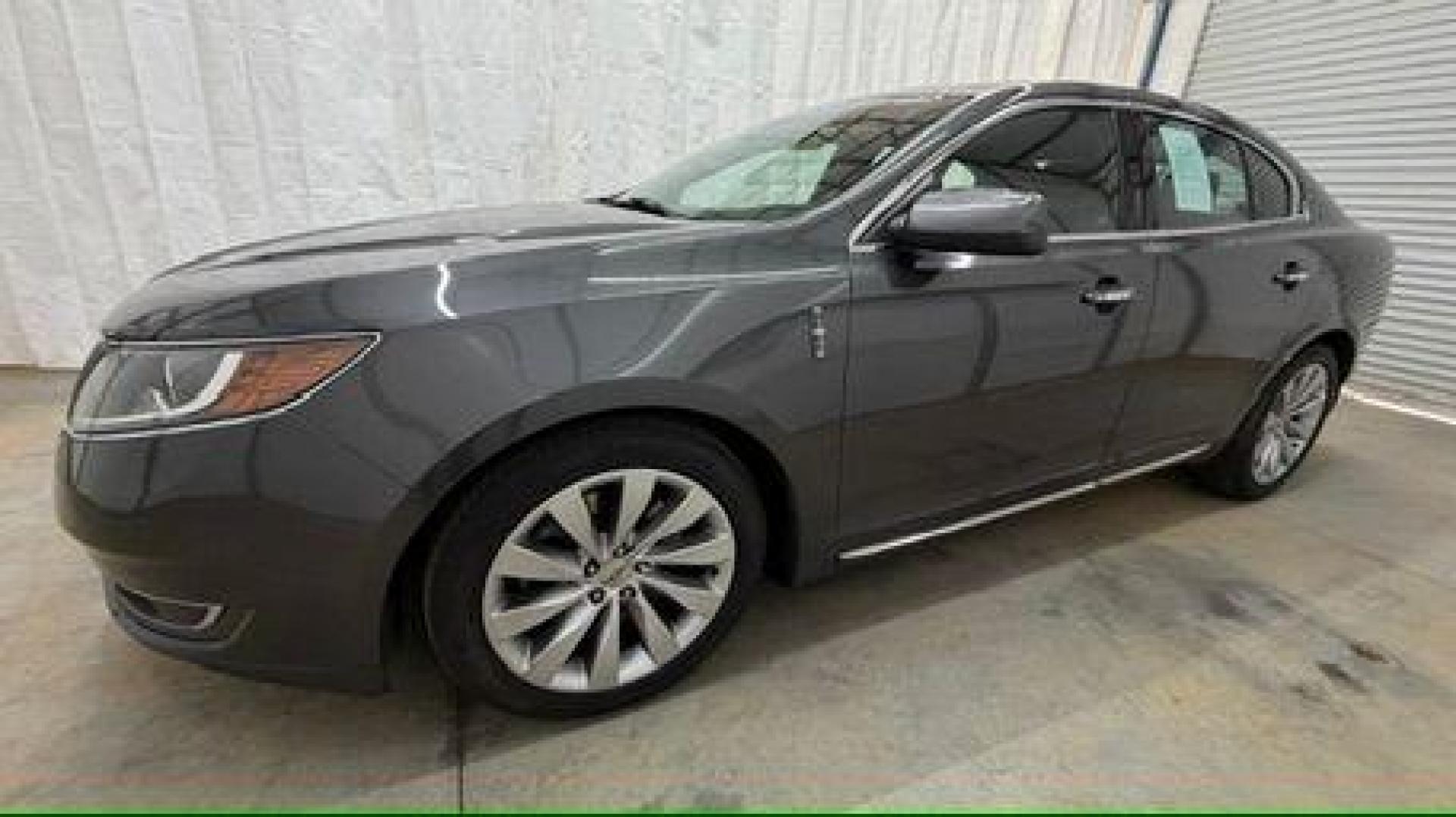2016 Gray Lincoln MKS 4DR (1LNHL9DK9GG) , located at 1806 Veterans Memorial Hwy SW, Austell, GA, 30168, (770) 944-9558, 33.817959, -84.606987 - Photo#1
