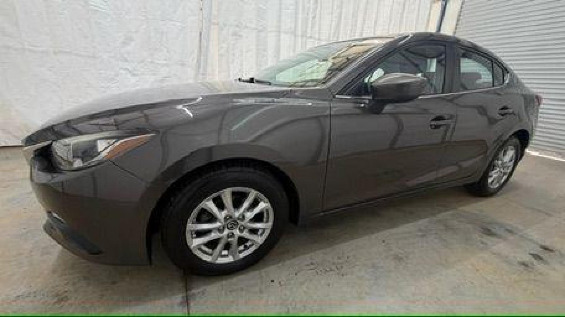 2014 Bronze Mazda Mazda3 i Touring (JM1BM1V74E1) with an SKYACTIV-G 2L I-4 gasoline direct injection engine, located at 1806 Veterans Memorial Hwy SW, Austell, GA, 30168, (770) 944-9558, 33.817959, -84.606987 - Photo#1