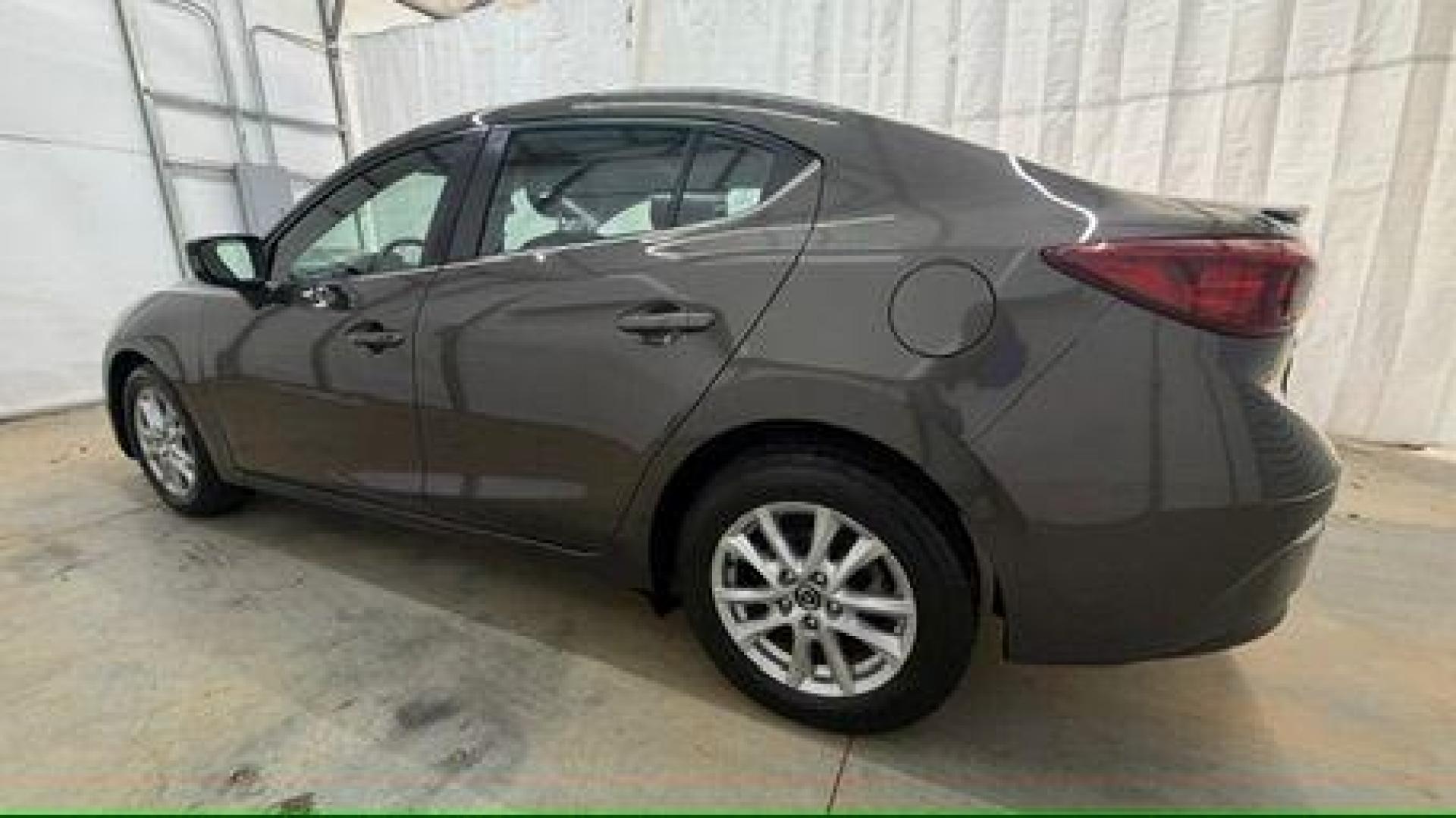 2014 Bronze Mazda Mazda3 i Touring (JM1BM1V74E1) with an SKYACTIV-G 2L I-4 gasoline direct injection engine, located at 1806 Veterans Memorial Hwy SW, Austell, GA, 30168, (770) 944-9558, 33.817959, -84.606987 - Photo#2
