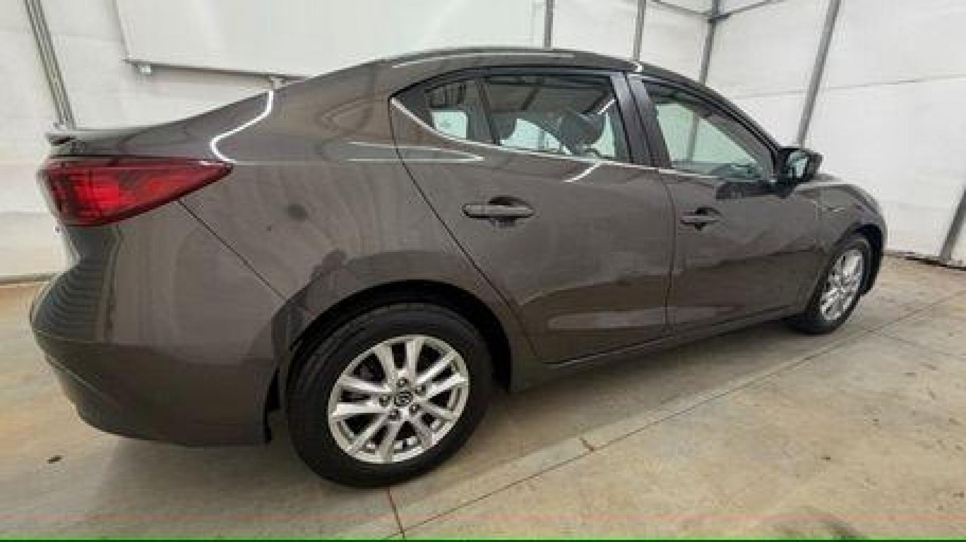 2014 Bronze Mazda Mazda3 i Touring (JM1BM1V74E1) with an SKYACTIV-G 2L I-4 gasoline direct injection engine, located at 1806 Veterans Memorial Hwy SW, Austell, GA, 30168, (770) 944-9558, 33.817959, -84.606987 - Photo#6